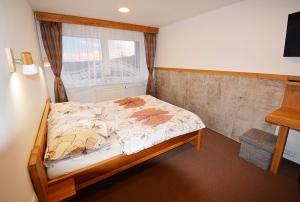 Voodi või voodid majutusasutuse Hotel Churáňov toas