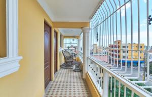 a balcony with a view of a city at Tropical Island Apartahotel in La Viva