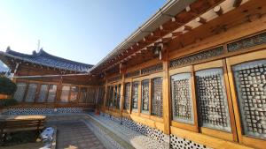a building with a bench in front of it at Shine Wolyeong in Andong