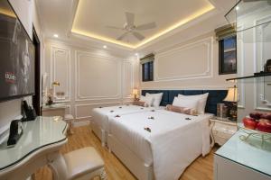 Voodi või voodid majutusasutuse Royal Holiday Hanoi Hotel toas