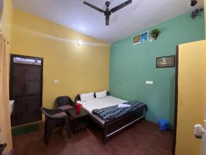 A bed or beds in a room at Breeze Arise Homestay By WB Inn