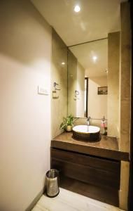 a bathroom with a sink and a mirror at Lavanya Villa with private pool Udaipur in Udaipur