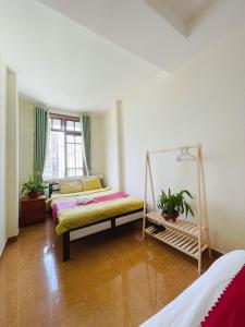 Postel nebo postele na pokoji v ubytování Homestay VICTORY