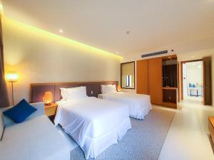 Кровать или кровати в номере Wyndham Cam Ranh Villa 1412