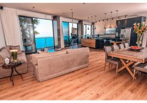 a living room with a couch and a table at Dream House Tiberias in Tiberias