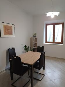 a wooden table and chairs in a room at Casa dei Faggi in Tolfa +28 photos