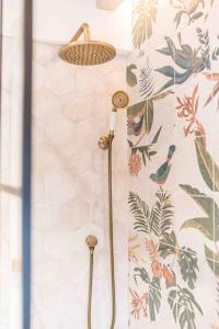 a bathroom with a shower with a shower head at Teapot Cottage in Ennerdale - Hot tub Pizza Oven Log Burner in Cleator +53 photos