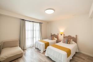 Posteľ alebo postele v izbe v ubytovaní Hotel Casa Palacio la Sal