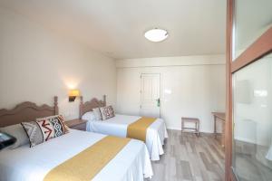 Posteľ alebo postele v izbe v ubytovaní Hotel Casa Palacio la Sal