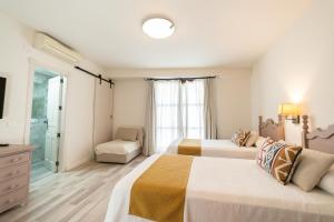 Posteľ alebo postele v izbe v ubytovaní Hotel Casa Palacio la Sal