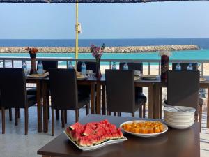 a table with food on it with a view of the ocean at Splendour Grand in Maalhos