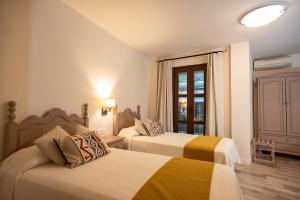 Posteľ alebo postele v izbe v ubytovaní Hotel Casa Palacio la Sal