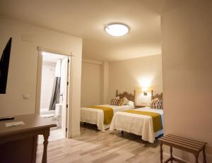 Posteľ alebo postele v izbe v ubytovaní Hotel Casa Palacio la Sal