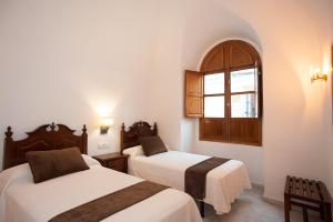 Posteľ alebo postele v izbe v ubytovaní Hotel Casa Palacio la Sal