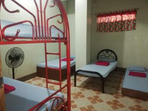 a room with two bunk beds and a window at MJ Transient Baguio Unit 202 in Baguio