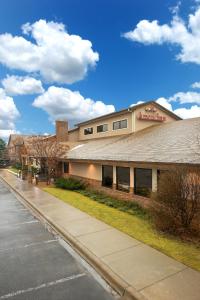 a building on the side of a street at AmericInn by Wyndham North Branch in North Branch