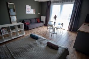 Posteľ alebo postele v izbe v ubytovaní Griff 1. apartman Pécs