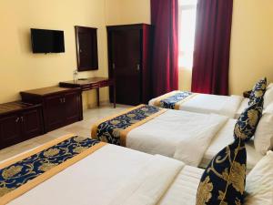 Letto o letti in una camera di Farah Hotel Apartment