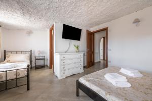 Ένα ή περισσότερα κρεβάτια σε δωμάτιο στο Villa Eleonora Residence App to 3 +14 φωτογραφίες