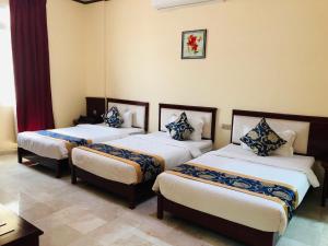 Letto o letti in una camera di Farah Hotel Apartment