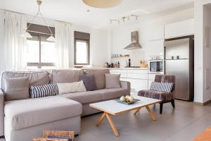 a living room with a couch and a table at The Coffee Houses Center in Tel Aviv