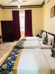 Letto o letti in una camera di Farah Hotel Apartment