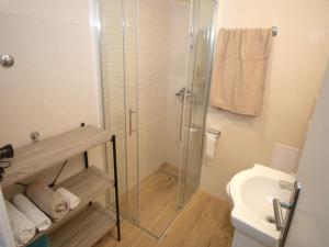 a bathroom with a shower and a toilet and a sink at Apartment Lea in Dubrovnik