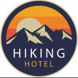 a logo for a hiking hotel with the sun and mountains at Hotel Hiking in Donja Ljuža