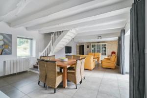 a dining room with a table and chairs at Villa de 4 chambres avec piscine privee jardin amenage et wifi a Saint Sylvestre sur Lot in Saint-Sylvestre-sur-Lot