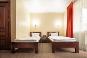 Postel nebo postele na pokoji v ubytování Private Rooms in Hotel GROFA 3 поверх