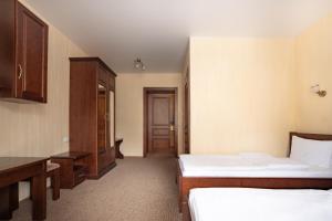 Postel nebo postele na pokoji v ubytování Private Rooms in Hotel GROFA 3 поверх