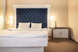 Postel nebo postele na pokoji v ubytování Private Rooms in Hotel GROFA 3 поверх