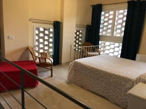 A bed or beds in a room at Poggio Savelli