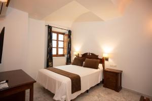 Posteľ alebo postele v izbe v ubytovaní Hotel Casa Palacio la Sal