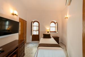 Posteľ alebo postele v izbe v ubytovaní Hotel Casa Palacio la Sal