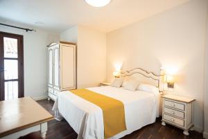 Posteľ alebo postele v izbe v ubytovaní Hotel Casa Palacio la Sal