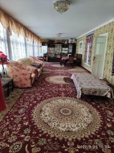 a living room with a couch and a rug at Spring Family Guest House in Tersak +121 photos