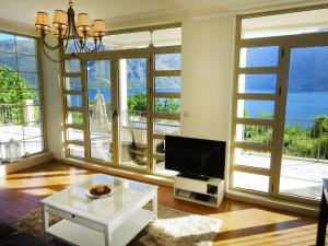 a living room with a view of the ocean at Blue Bay 2 bedroom apartment in Prčanj