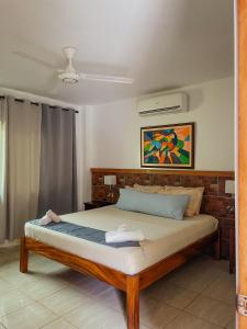 a bedroom with a large bed in a room at South Mountain Resort in Siquijor