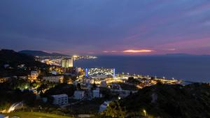 a view of a city at night at Monte Smith Luxury Villas in Rhodes Town