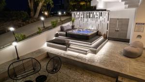 a living room with a couch and a hot tub at Monte Smith Luxury Villas in Rhodes Town