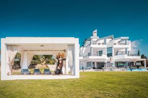 a person standing in front of a large building at Monte Smith Luxury Villas in Rhodes Town +107 photos