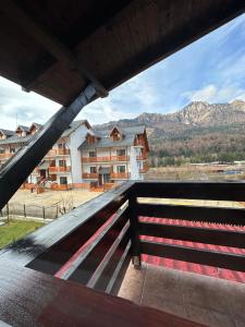 a view from the balcony of a building with mountains at Casa Rares Busteni in Buşteni