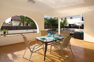 a dining room with a table and chairs at Villa Merry in Ayia Napa