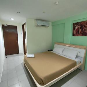 Postel nebo postele na pokoji v ubytování Best One Hotel