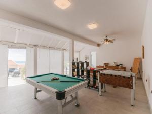 a living room with a pool table in it at Villa Blanka in Podgora