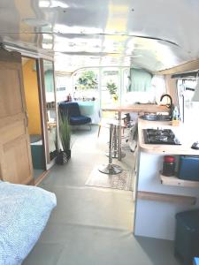 a kitchen and dining area of an rv at Esprit Péniche in Nantes