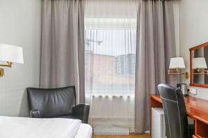 Postel nebo postele na pokoji v ubytování Best Western Ta Inn Hotel