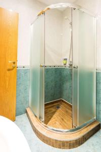 a shower with a glass enclosure in a room at Best Western Lozenetz Hotel in Sofia