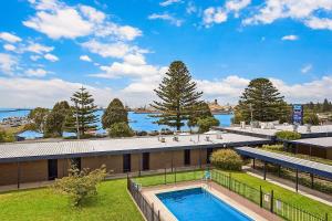 an overhead view of a building with a swimming pool at Richmond Henty Hotel in Portland